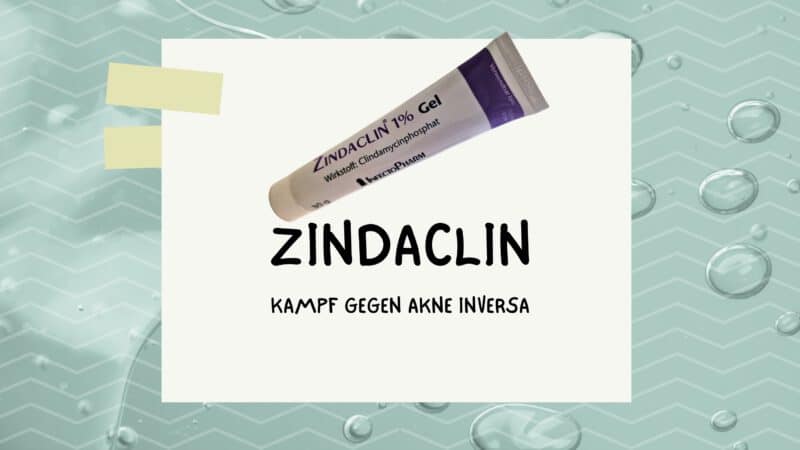 Eine Tube Zindaclin 1% Gel, eingesetzt im Kampf gegen Akne Inversa, abgebildet vor einem Hintergrund mit Wassertröpfchen.