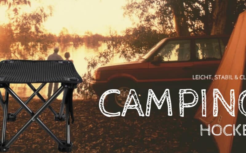 Faltbarer Camping Hocker vor Zelt und Geländewagen am See bei Sonnenuntergang – leichte, stabile Sitzlösung für Outdoor‑Touren.