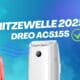 Frau in Winterkleidung neben einer Dreo AC515S mobilen Klimaanlage mit Schriftzug „Hitzewelle 2025“.